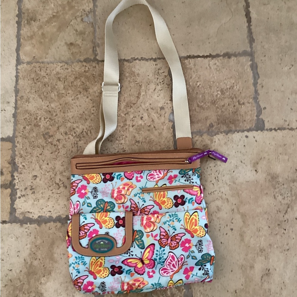 Lily Bloom Crossbody Purse Hand Bag Butterflies
Width 12”
Length 13”
Strap 19”